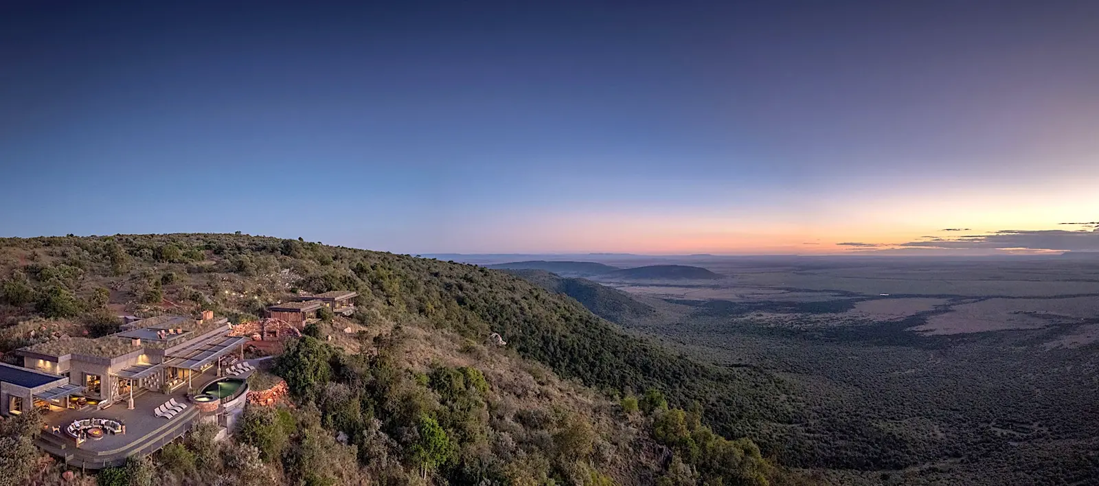 Exclusive use private villa on a hilltop overlooking the Maasai Mara at dusk