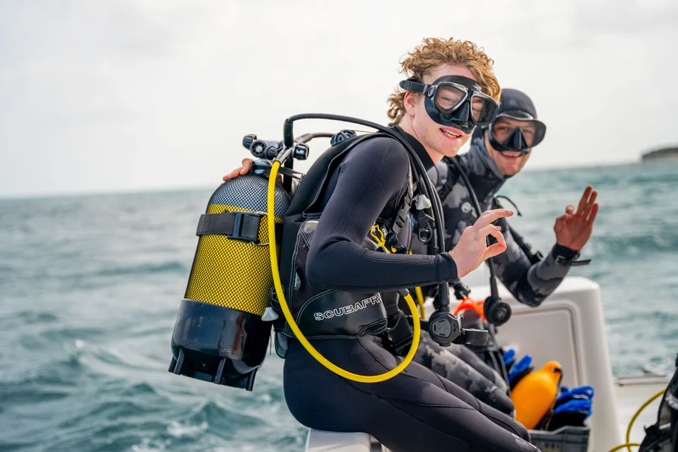 A young diver exploring the clear waters off the Mozambique coast