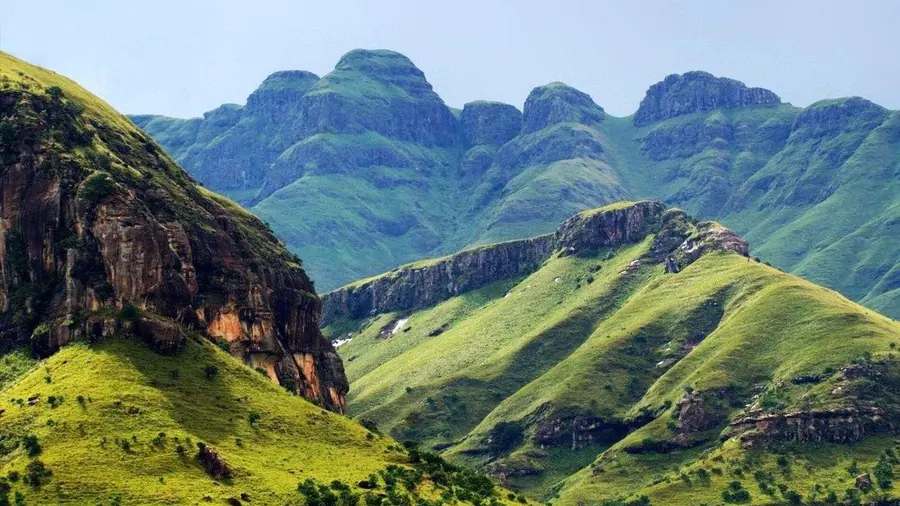 Green sandstone peaks and grassy slopes of the Drakensberg in KwaZulu-Natal, South Africa