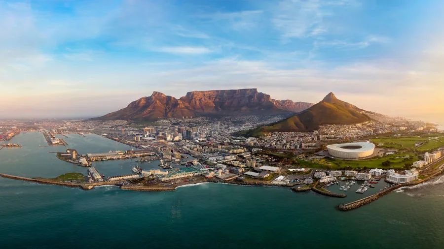 Aerial view of Cape Town at sunrise with Table Mountain, Lion's Head and the V&A Waterfront, South Africa