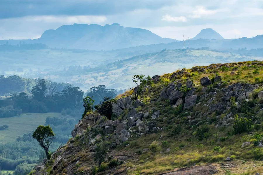 Misty green mountains and rocky ridgeline of the Eastern Highlands near Nyanga, Zimbabwe